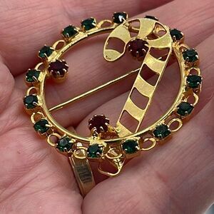 Vintage rhinestone wreath candy cane brooch.